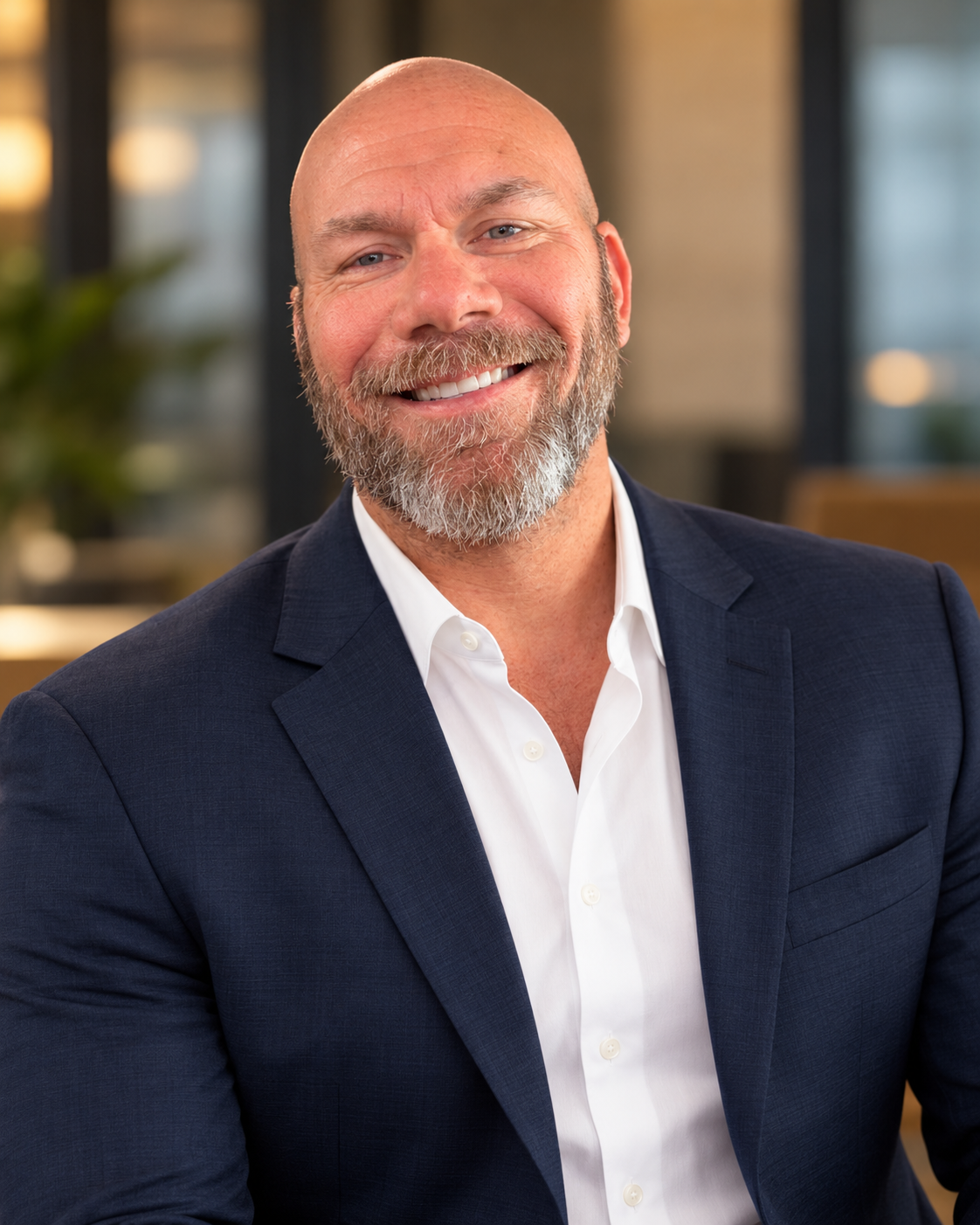Eric Holmgren, founder of Holmgren Advisory Group, in a navy suit and white shirt